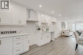 Waterloo apartment for rent - A white kitchen with a sign that says "Kitchen" on the counter.