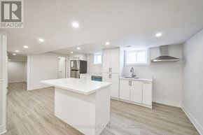 Burlington (Shoreacres) apartment for rent - A white kitchen with a large island in the middle.