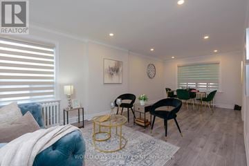 Toronto (O'connor-Parkview) apartment for rent - A living room with a blue sofa and a gold coffee table.