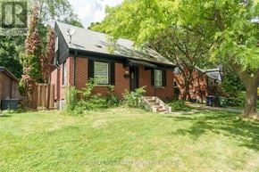 Toronto (O'connor-Parkview) apartment for rent - A red brick house with a green lawn in front.