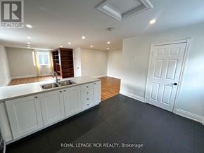 Caledon apartment for rent - A kitchen with white cabinets and a sink is shown.
