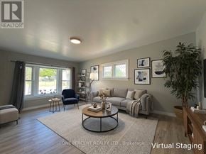 Niagara Falls (Downtown) apartment for rent - A living room with a couch, chair, and coffee table.