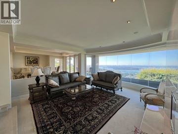 West Vancouver apartment for rent - A living room with a large rug and a couch.