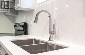 Hamilton (Gilbert) duplex for rent - A modern kitchen with a sink and a faucet.