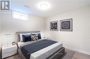 Hamilton (Gilbert) duplex for rent - A bedroom with a large bed and two pictures on the wall.