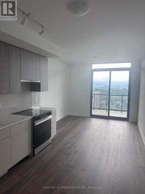 Burlington (Brant) condo for rent - A kitchen with a view of the city.