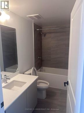 Burlington (Brant) condo for rent - A bathroom with a toilet, sink, and shower.