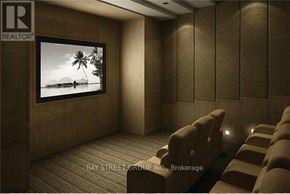 Toronto (Thorncliffe Park) condo for rent - A home theater room with a large screen and multiple recliner seats.