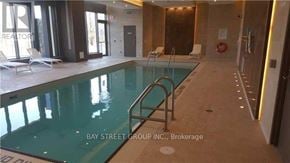 Toronto (Thorncliffe Park) condo for rent - A pool inside a building with the words "Bay Street Group, Inc., Brokerage" written on the bottom.