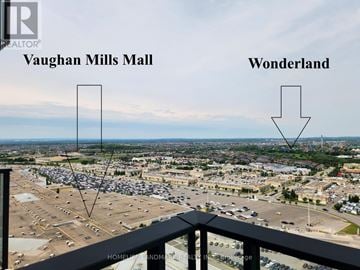 Vaughan (Vellore Village) condo for rent - A picture of a Vaughan Mills Mall parking lot with a sign pointing to Wonderland.