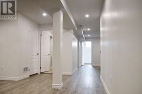 Markham (Cedar Grove) apartment for rent - A long hallway with white walls and wood flooring.
