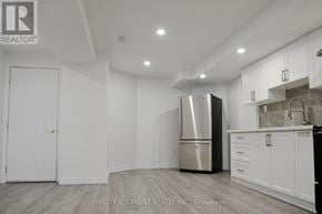 Markham (Cedar Grove) apartment for rent - A kitchen with a refrigerator, cabinets, and a counter.