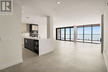 Fort Erie (Crystal Beach) condo for rent - A spacious kitchen with a marble countertop and a view of the ocean through the windows.