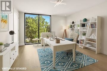 Fort Erie (Crystal Beach) condo for rent - A living room with a white sofa and a blue rug.