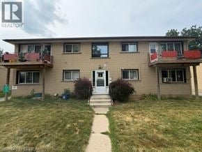 Brantford apartment for rent - A two-story building with a balcony on the second floor.