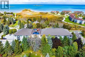 Collingwood condo for rent - A bird's eye view of a residential area with houses and trees.