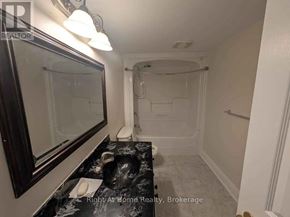 Clarington (Bowmanville) apartment for rent - A bathroom with a walk-in shower and a sink.