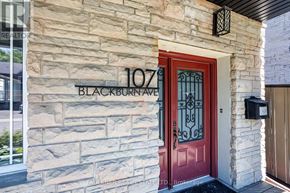 Ottawa apartment for rent - The front door of a house with a red door and a stone wall.