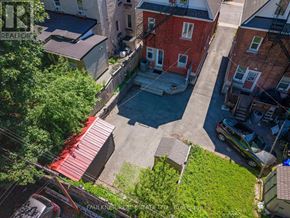 Ottawa apartment for rent - An aerial view of a residential area with houses and cars.