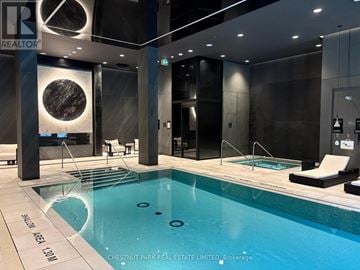 Toronto (Mount Pleasant West) condo for rent - A swimming pool in a modern indoor setting.