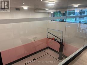 Toronto (Mount Pleasant West) condo for rent - A basketball hoop is mounted on a glass wall in a room.