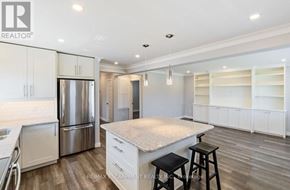 Burlington (Mountainside) apartment for rent - A kitchen with white cabinets and a refrigerator.