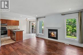Ottawa apartment for rent - A large open living room with a fireplace and sliding glass doors.