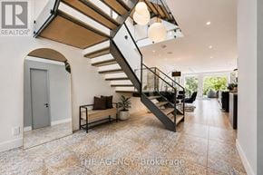 Toronto (North Riverdale) apartment for rent - A modern home interior with a staircase and a bench.