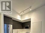 Brampton (Northwest Brampton) condo for rent - A kitchen with a refrigerator and a sink.