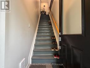 Russell condo for rent - Shoes are lined up on a staircase.