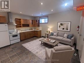 Mississauga (Port Credit) multi-family for rent - A well-lit kitchen with a dining table and chairs.
