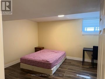 Toronto (Kingsview Village-The Westway) apartment for rent - A bedroom with a pink bedspread and a small bed.
