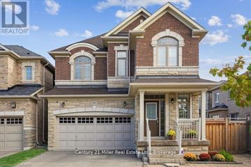 Oakville (Jm Joshua Meadows) apartment for rent - A house with a garage and a balcony is for sale.