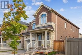Oakville (Jm Joshua Meadows) apartment for rent - A brick house with a blue window and a white porch.
