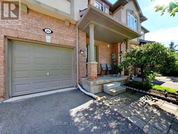 Richmond Hill (Oak Ridges) townhouse for rent - A house with a garage and a realtor sign.