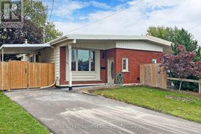 Hamilton (Lawfield) apartment for rent - A house with a red brick exterior and a white roof is for sale.