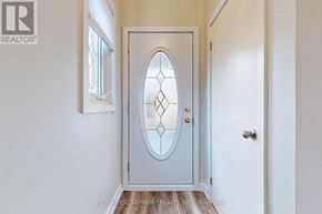 Hamilton (Lawfield) apartment for rent - A white door with a glass window in the middle.