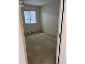 Vancouver apartment for rent - A room with a window and a sliding door.