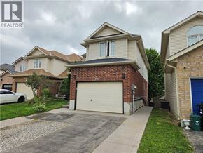 Kitchener apartment for rent - A house with a garage is for sale.