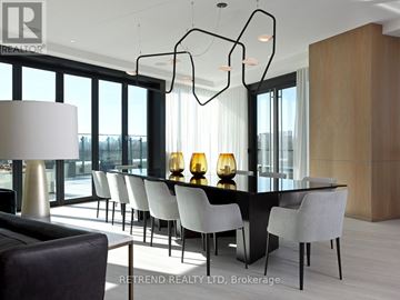 Toronto (North St. James Town) condo for rent - A modern dining room with a long table and chairs.