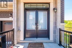 Vaughan (Kleinburg) apartment for rent - A brown door with a glass window is the main focus of the image.