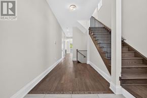 Vaughan (Kleinburg) apartment for rent - A hallway with a staircase and wooden floors.