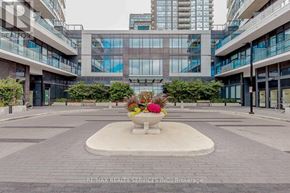 Mississauga (Hurontario) condo for rent - A courtyard with a fountain and a building in the background.