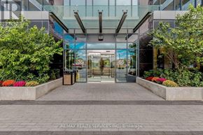 Mississauga (Hurontario) condo for rent - The entrance to a building with glass doors and a glass roof.