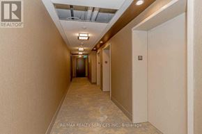 Mississauga (Hurontario) condo for rent - A hallway with a light on the ceiling and doors on the right.