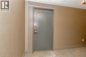 Mississauga condo for rent - A grey door in a room with a REALTOR sign on the wall.