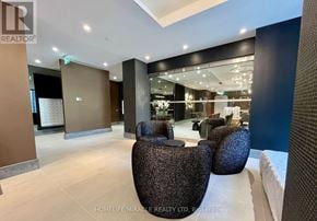 Toronto (Waterfront Communities) condo for rent - A spacious office lobby with a reception desk and seating area.
