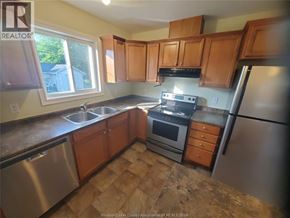 Windsor apartment for rent - A kitchen with wooden cabinets and stainless steel appliances.
