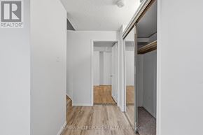 Pickering (Amberlea) apartment for rent - A brokerage sign is on the wall of a white room.