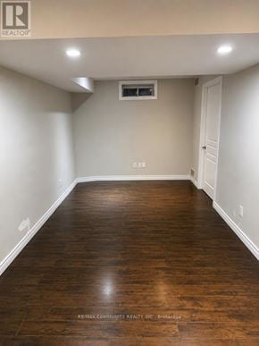 Markham (Berczy) apartment for rent - A room with wooden floors and white walls.